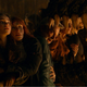 The cast cowers as a giant dino comes after them.